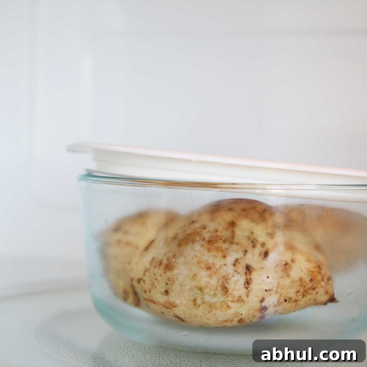 cover sweet potatoes for microwave cooking