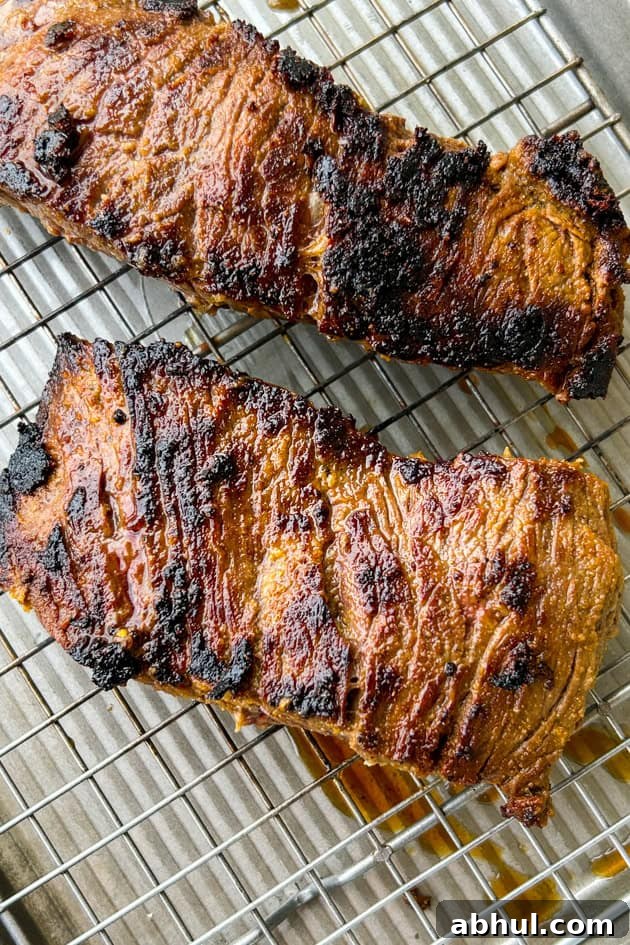 mojo marinated steak seared in a cast-iron pan