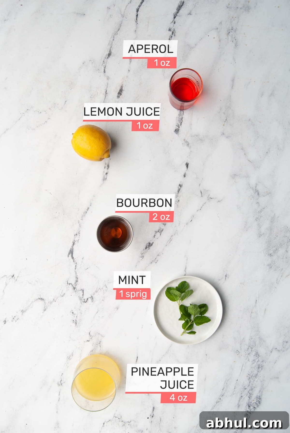 aperol, lemon juice, bourbon, mint, and pineapple juice