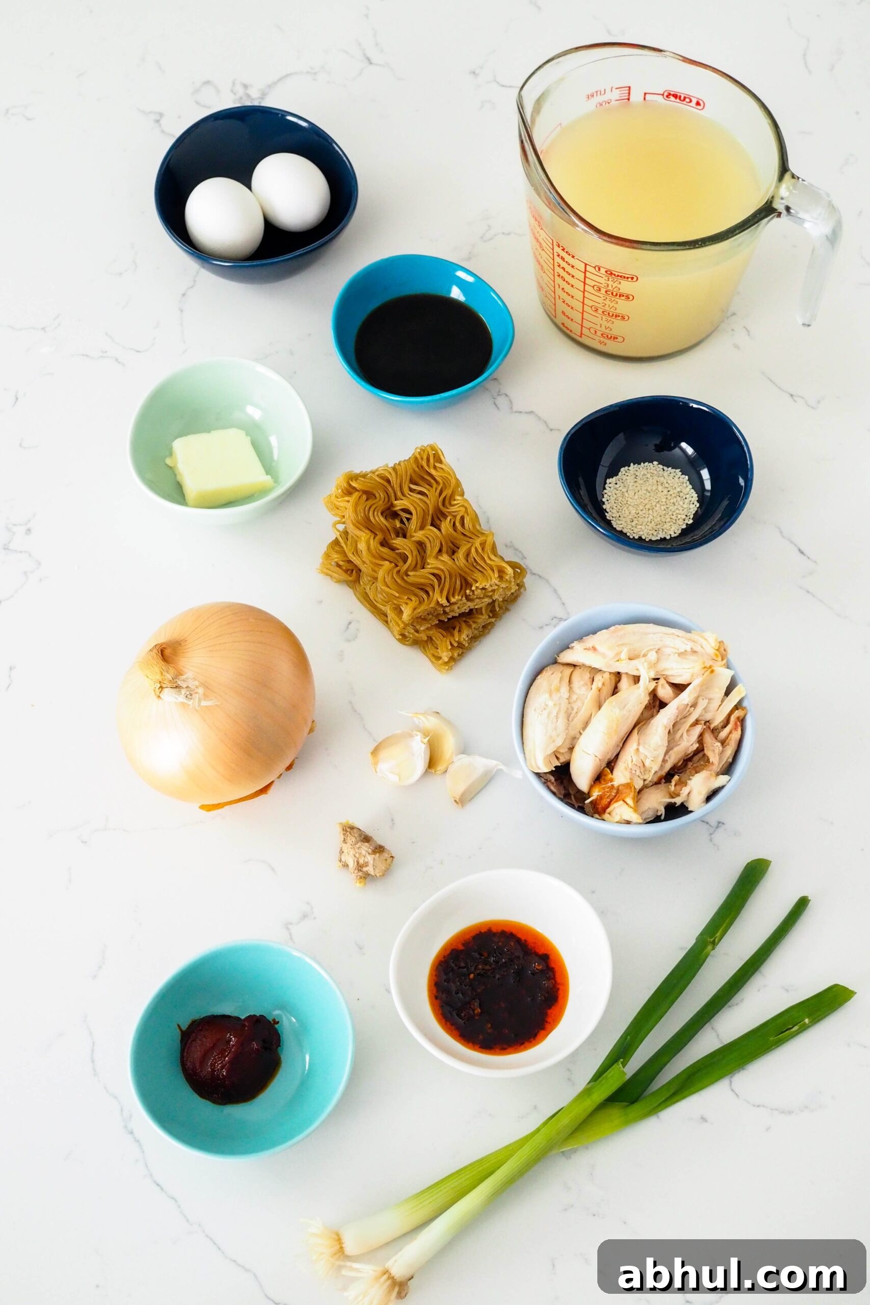 Spicy Gochujang Chicken Ramen Recipe for Quick Weeknights 3 Ingredients for easy gochujang chicken ramen arranged on a counter.