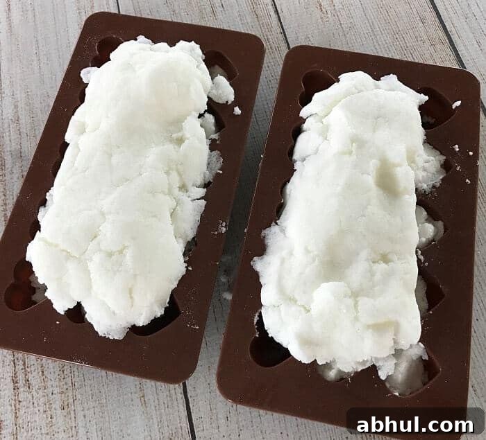 Pressing scrub dough into heart molds