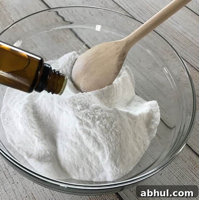 Adding essential oils to scrub mixture