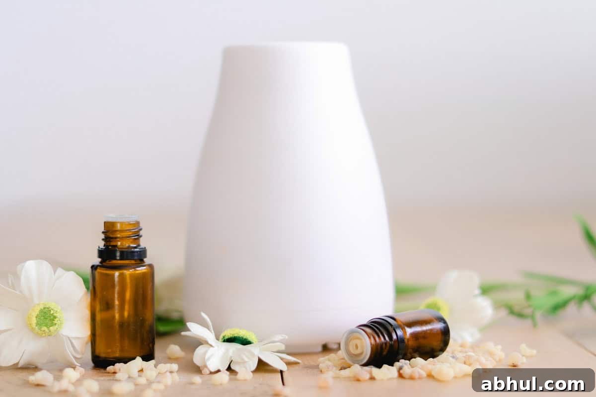 Tall diffuser with essential oil bottles for mood support next to it on a wooden table. 