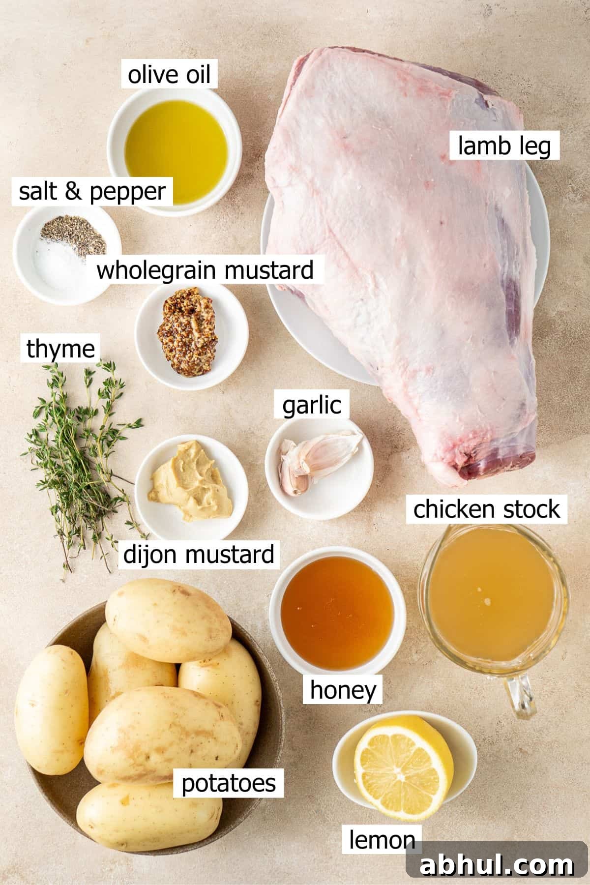 All ingredients needed to make glazed lamb laid out in bowls.