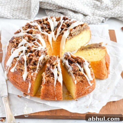 bundt cake sliced up on a wooden board.