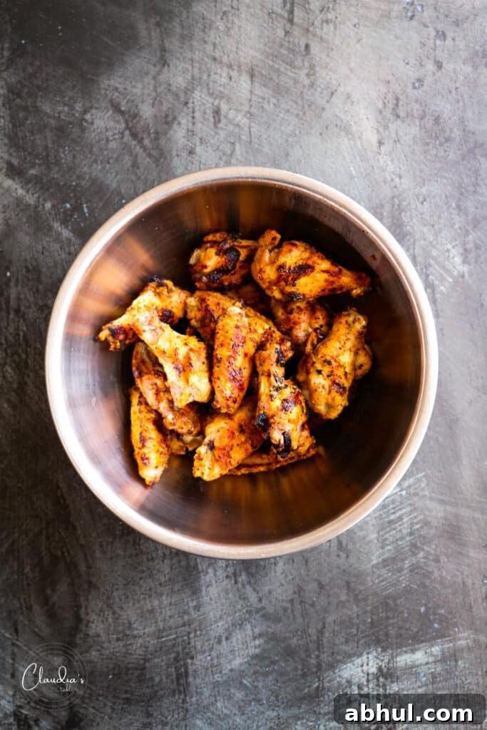 add sauce to wings and toss