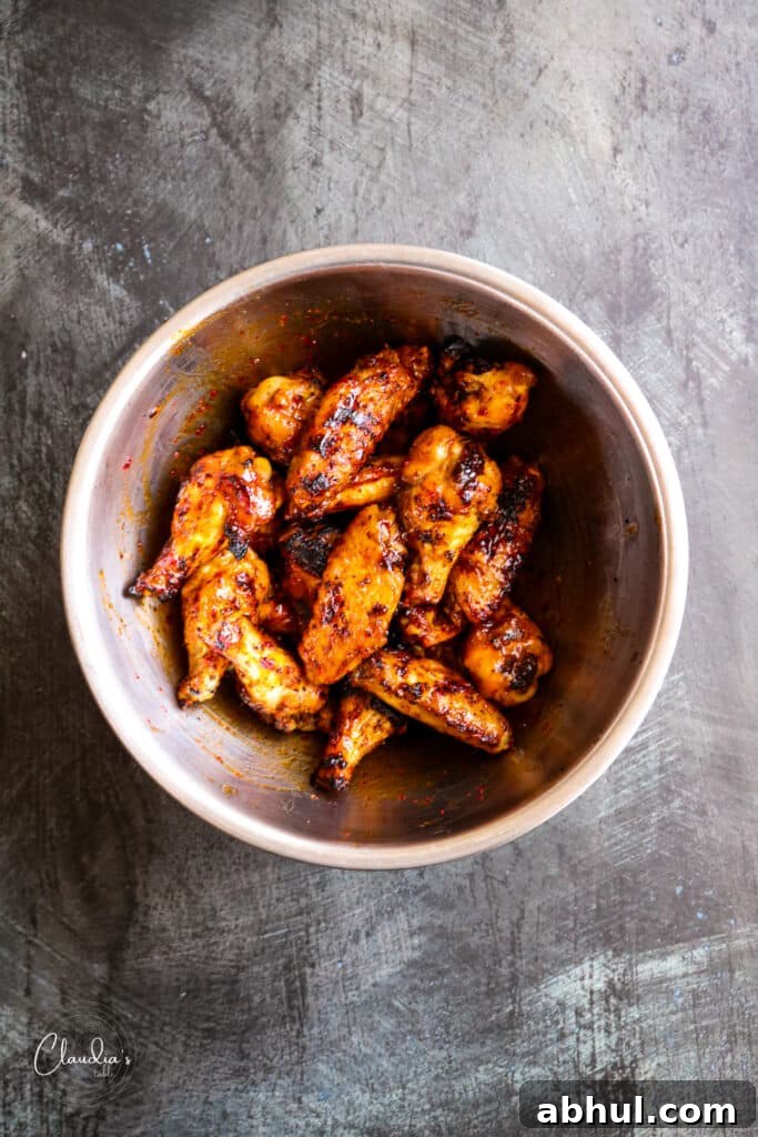 ensure the wings are completely coated with sauce