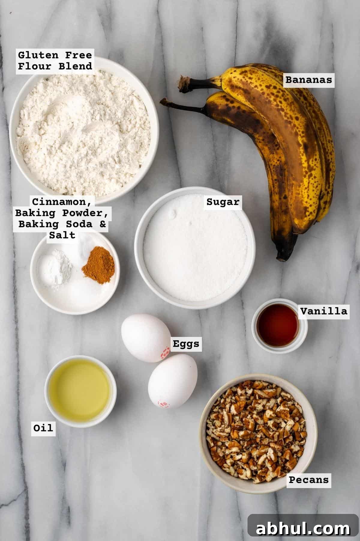 Ingredients for gluten free banana bread on a marble table.