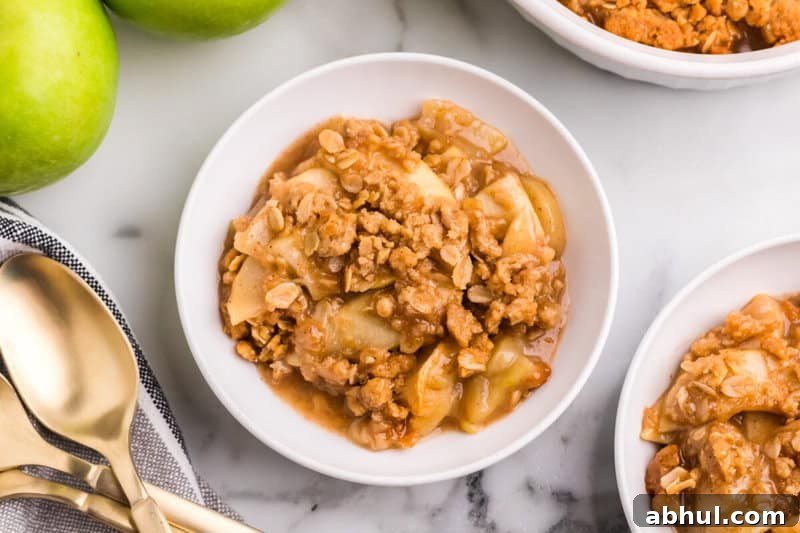 Apple Crisp served in white bowls.