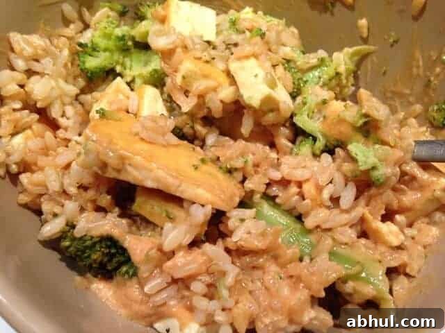 Tofu, spinach, and rice tossed in a homemade peanut sauce.