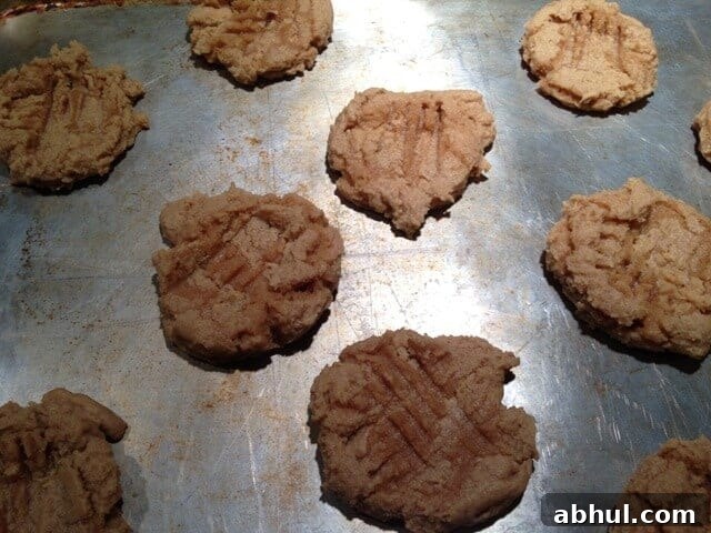 Baked vegan peanut butter cookies on a baking sheet.