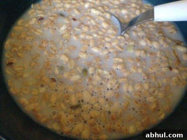 Bowl of pumpkin flax granola in soymilk.