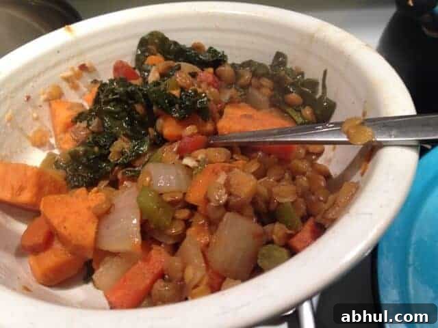 Dinner bowl of lentils with kale and yam.