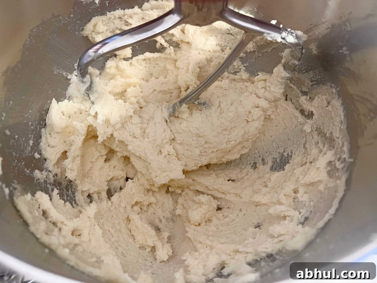 Beating the Butter and Sugar in mixing bowl.