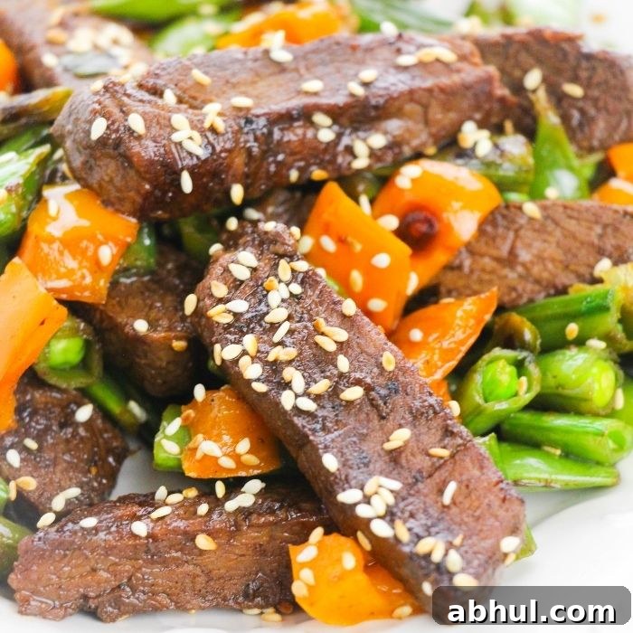 close up of beef stir fry on plate 