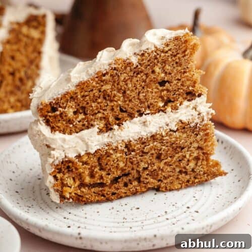 A slice of pumpkin spice latte cake on a plate.