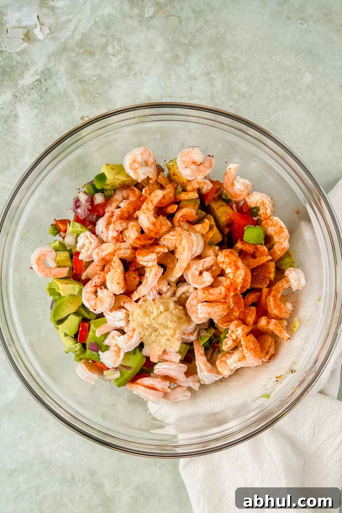 shrimp, seasonings, and ginger added to large mixing bowl with vegetables.