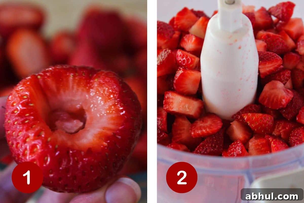 Hulling the strawberries and breaking them down in a food processor.