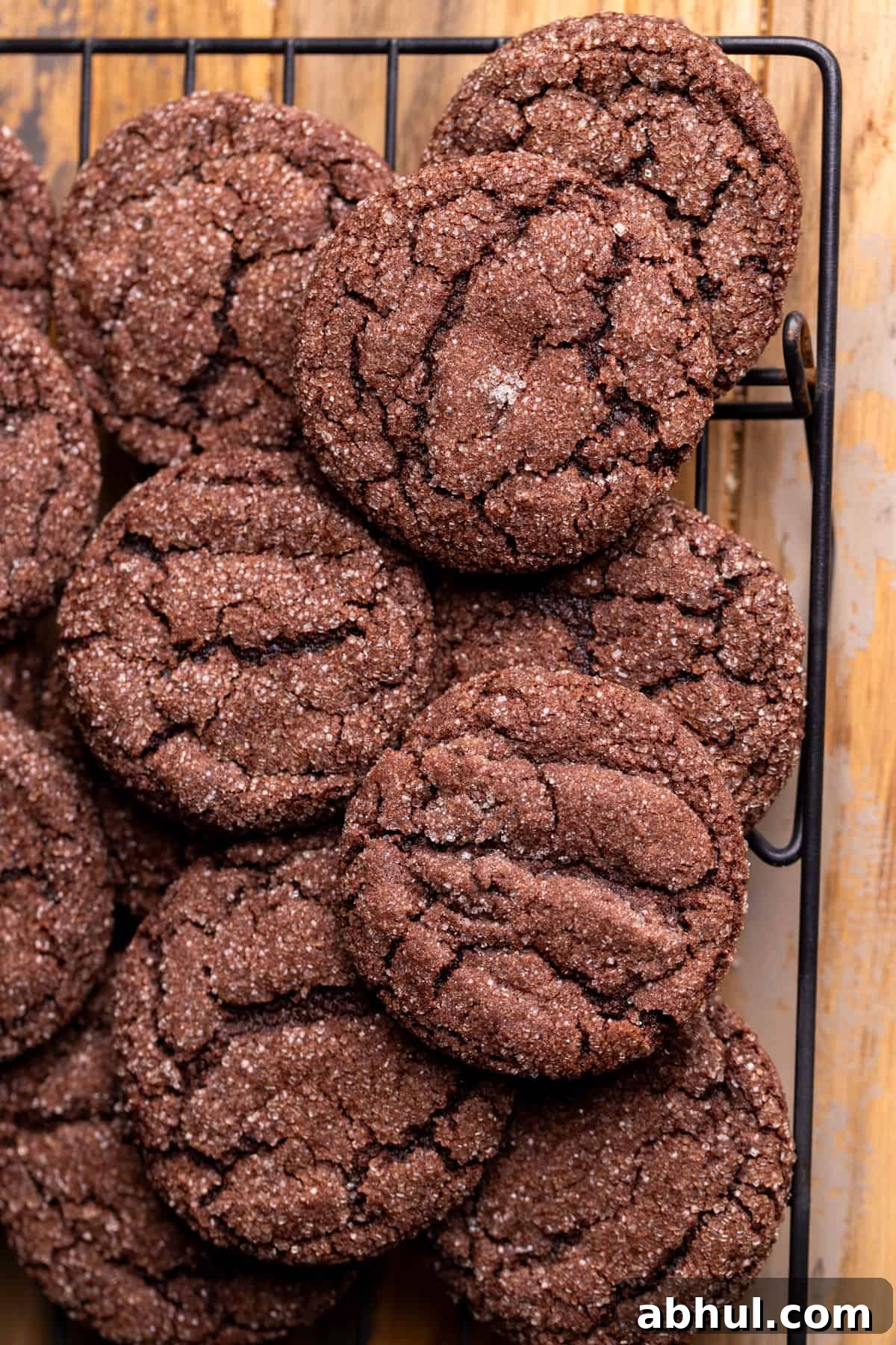Baked chocolate cookies on a wire rack.