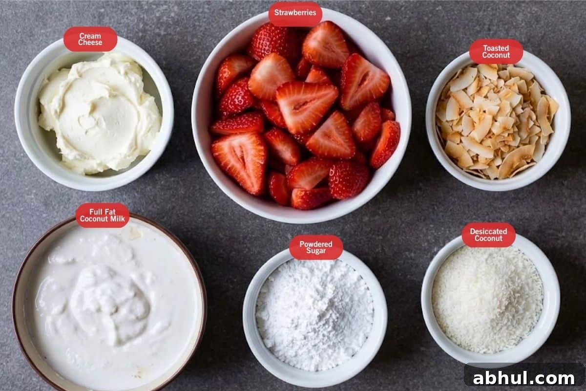 Flat lay photo of cream cheese, strawberries, toasted coconut, desiccated coconut powdered sugar, full fat fat coconut milk