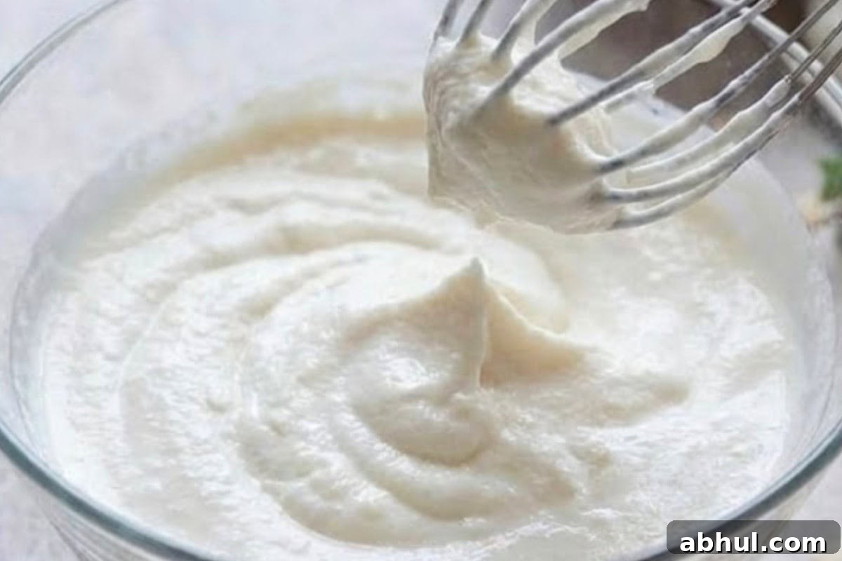 Beat the coconut cream until thick, smooth, and airy, similar to softly whipped cream.