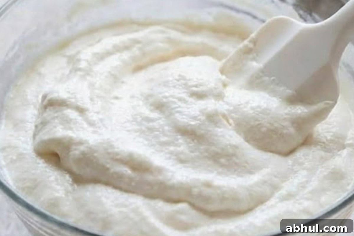 Gently fold the whipped coconut cream into the cream cheese mixture