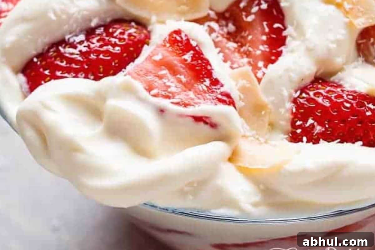 Transfer to a serving bowl and decorate with toasted coconut and extra strawberry slices if desired.