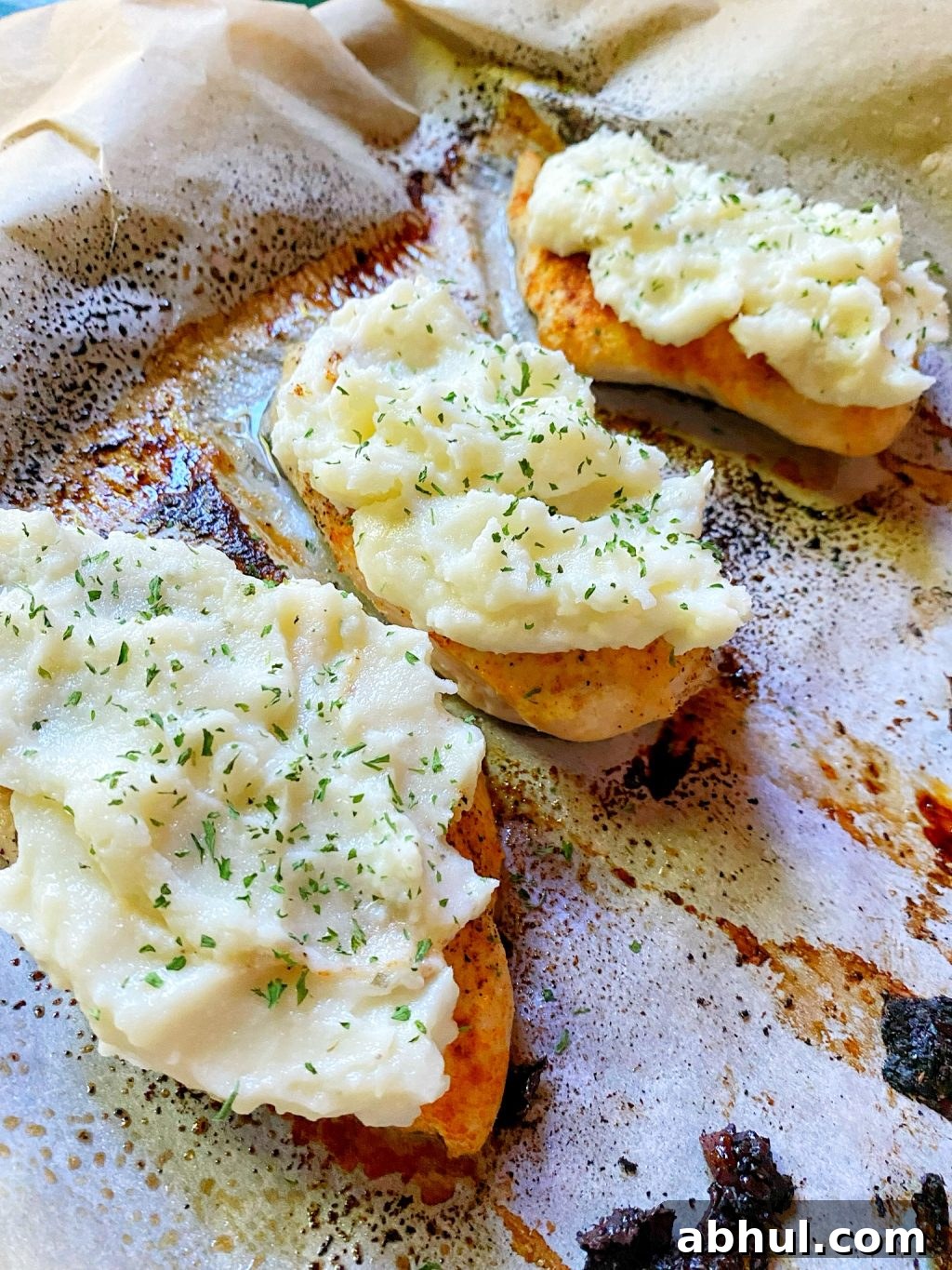 Chicken breasts topped with mashed potatoes