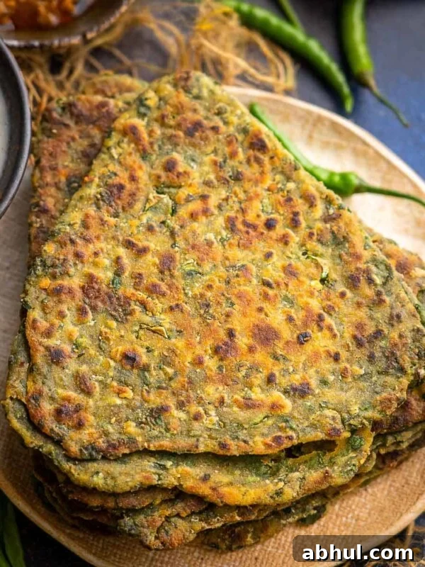 Palak Paratha (Spinach Paratha) is an unleavened Indian flatbread made using whole wheat flour, spinach and mild spices. It can be served for breakfast, lunch or dinner. Try it!