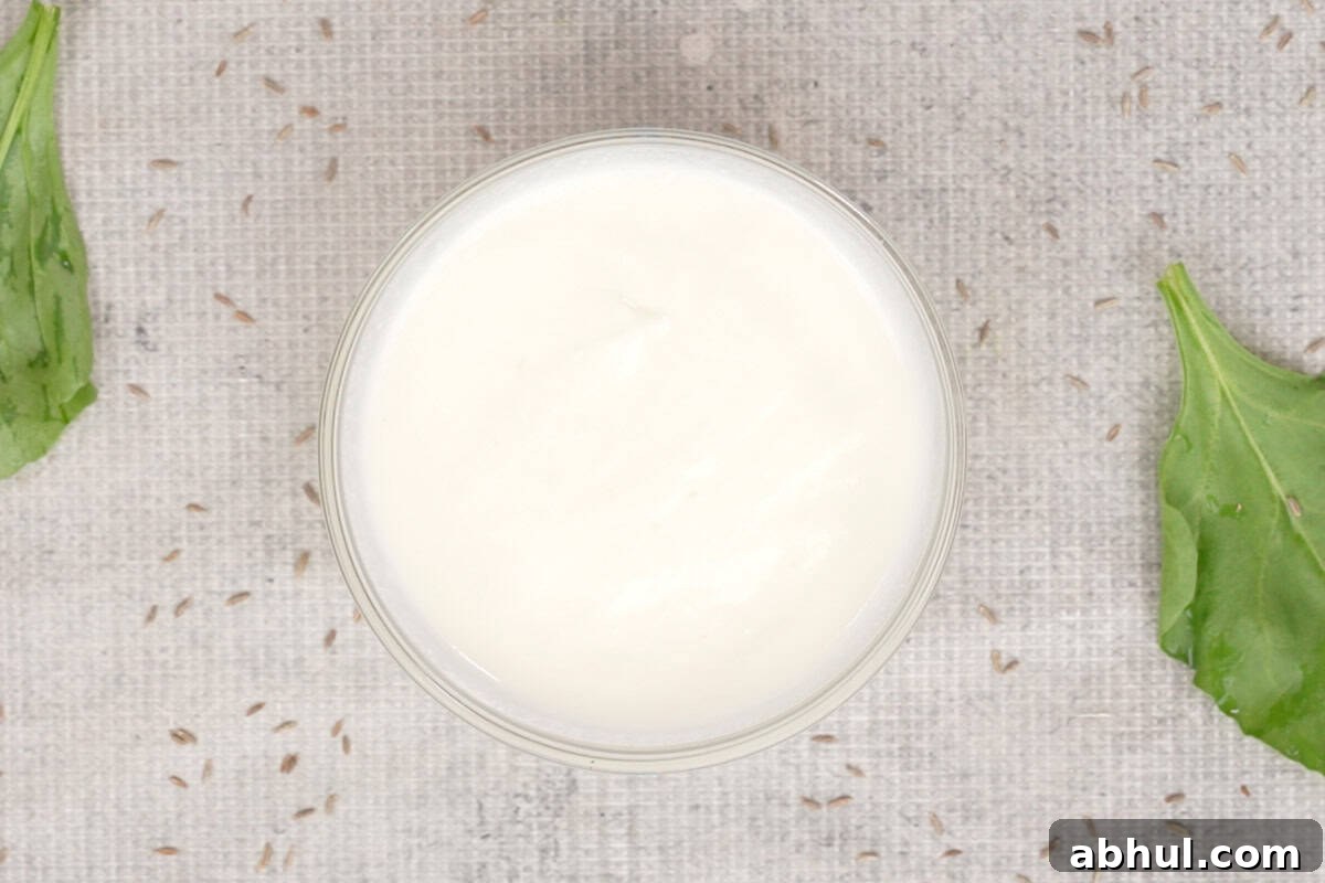 Yogurt whisked with sugar and salt.