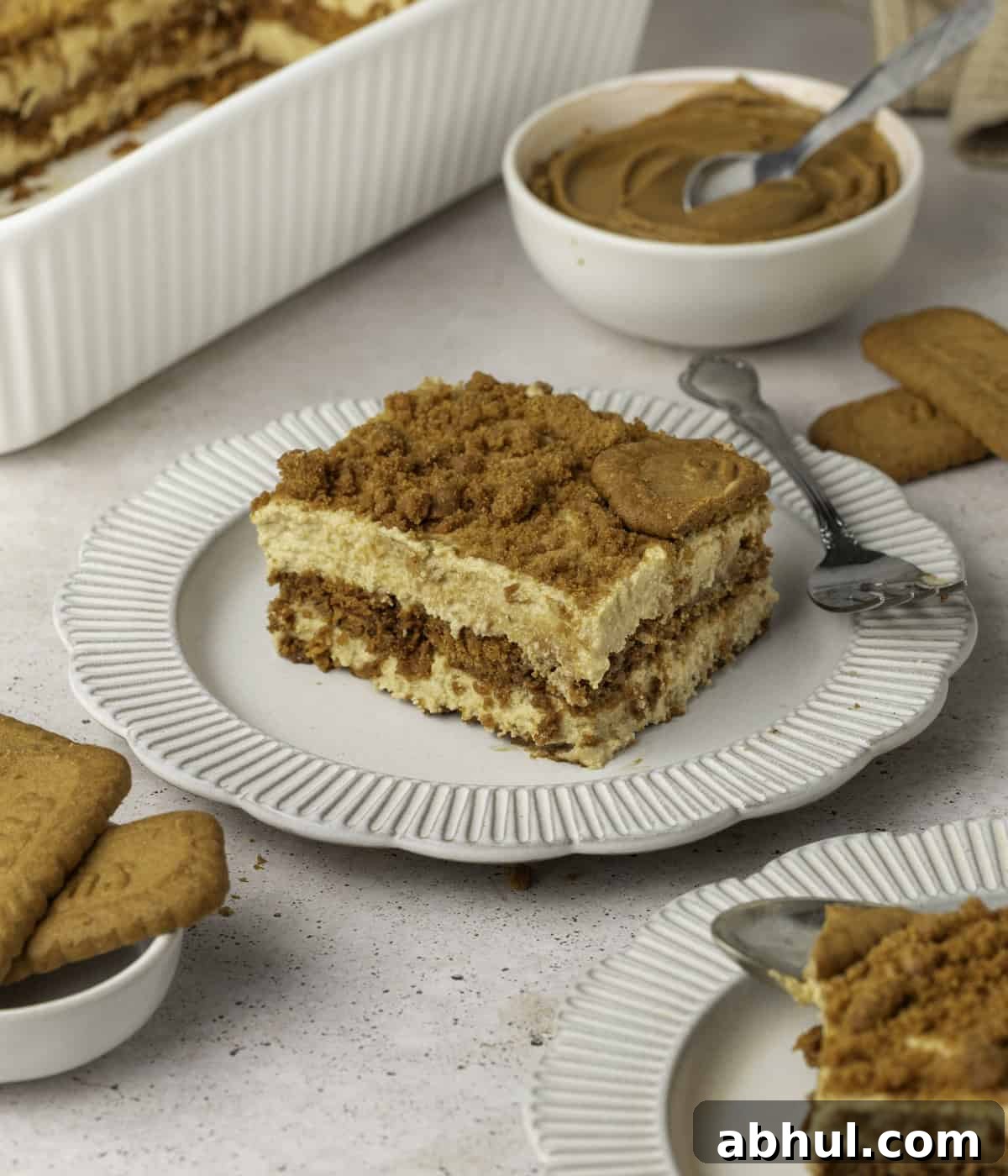 One slice of tiramisu on a white plate.