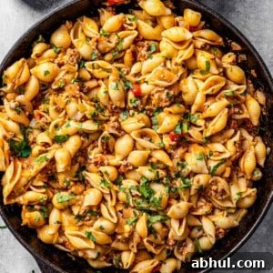 Overhead of taco pasta in a skillet.