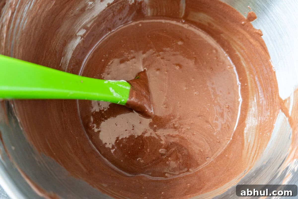 flour and buttermilk mixture folded into cupcake batter.