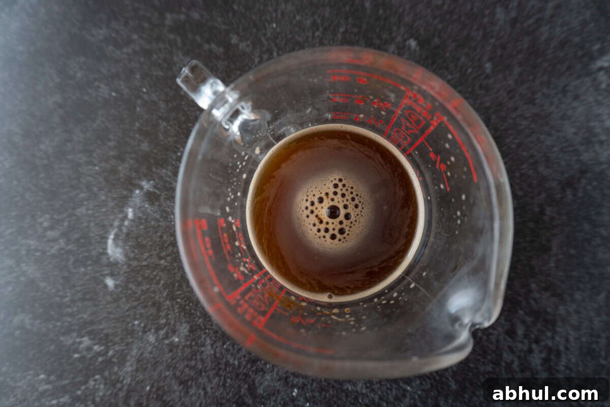 espresso mixture in glass measuring cup.