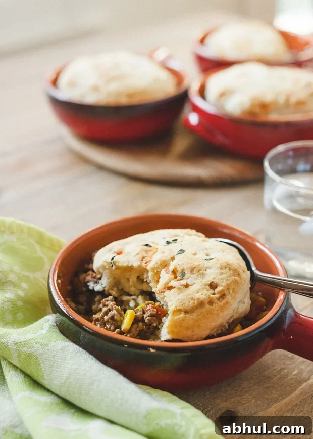 Buttermilk-Gruyere Biscuit Topped Shepherd's Pie in a handled ombre'd dish.