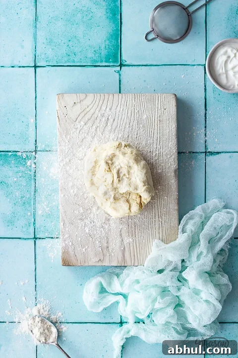 Scrappy quick pizza dough on a wooden board