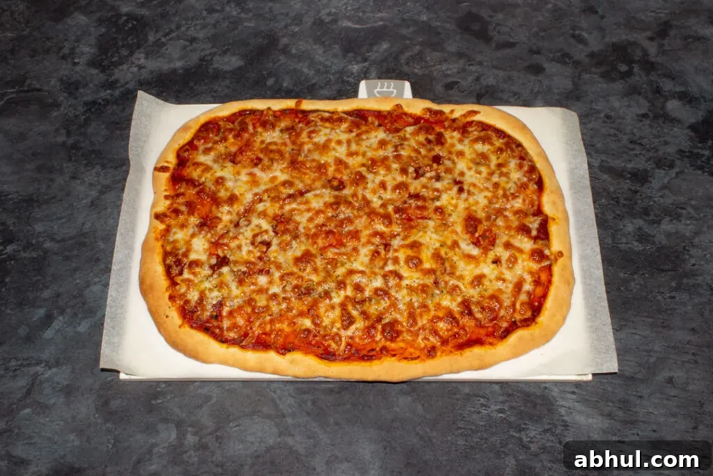 Cooked homemade pizza on baking paper