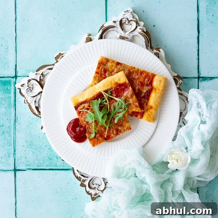 A plate of sliced pizza on a white patterned board