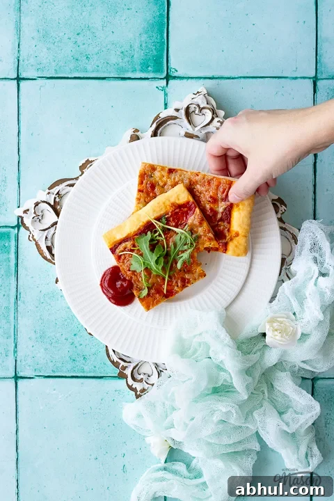 Someone taking a slice of pizza