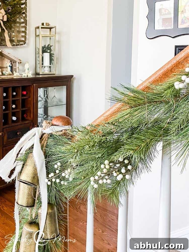 Top Target Christmas Decor Picks for Festive Holiday Style 14 Christmas garland with white berries hung on staircase railing