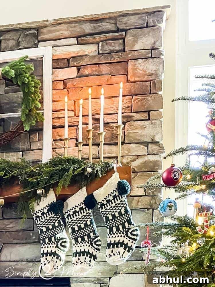 Top Target Christmas Decor Picks for Festive Holiday Style 9 fireplace mantle with stockings and greenery with candles