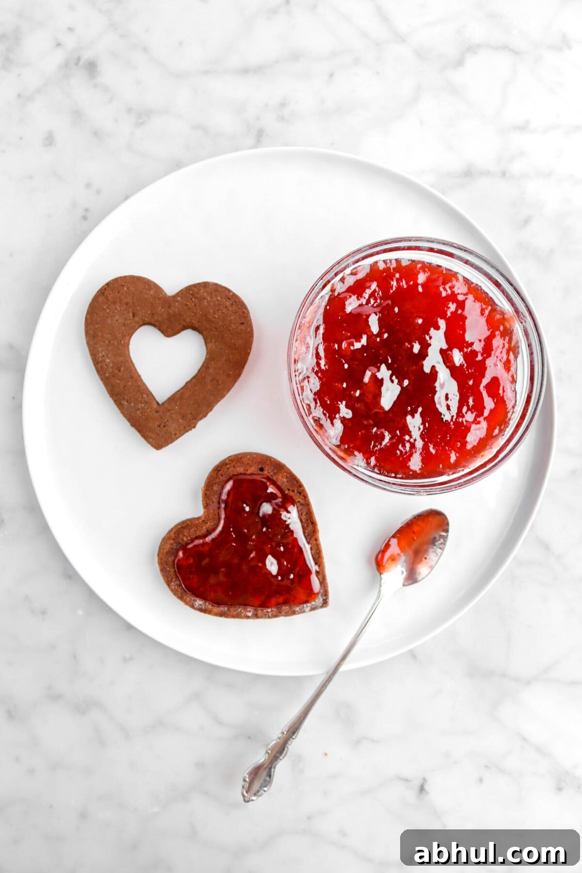 Chocolate-Strawberry Linzer Cookie Recipe for Perfect Sandwich Cookies 24 strawberry jam added on top of cookie