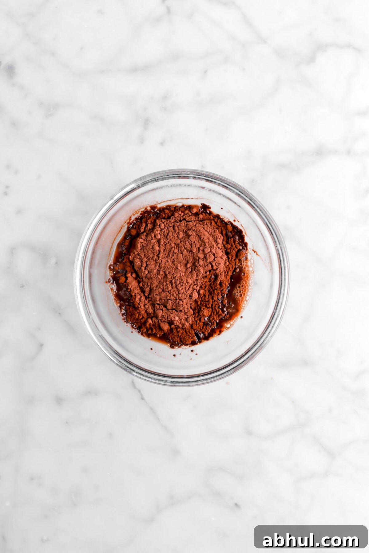 Chocolate-Strawberry Linzer Cookie Recipe for Perfect Sandwich Cookies 8 cocoa powder and water in small glass bowl