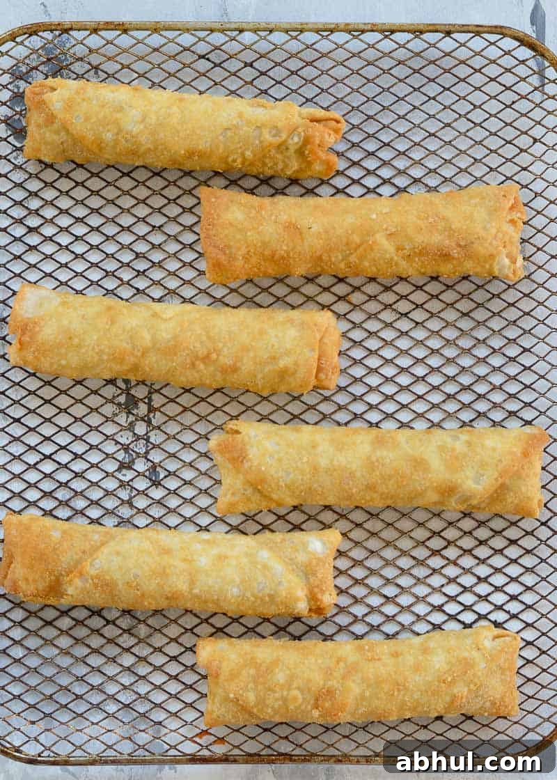 Crispy Air-Fried Egg Rolls: Quick Recipe for Homemade Crunch 6 frozen egg rolls on a rack
