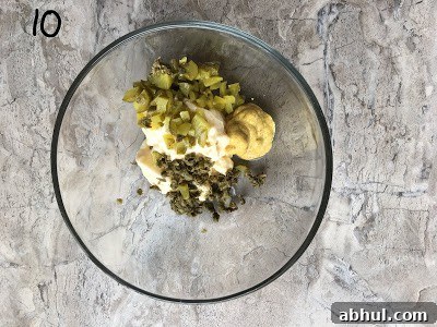 All ingredients for tartar sauce added to the bowl.