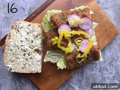 Add all the ingredients for the sandwich.