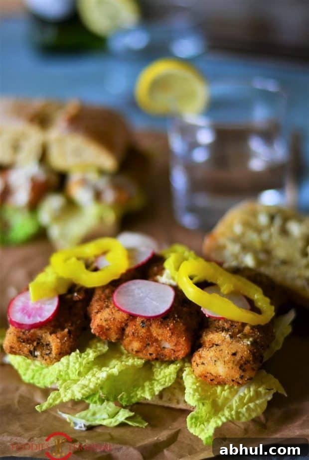 Sandwich stuffed with fish-fingers and other stuffings.