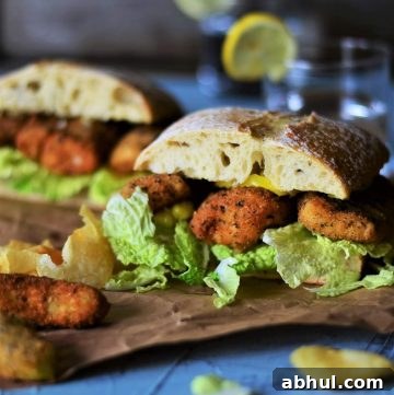 Home-made Fish Finger Sandwich with Pickled Banana Pepper Rings.