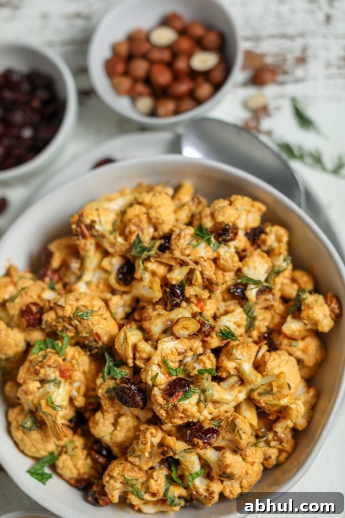 Harissa Roasted Cauliflower with Cranberries & Hazelnuts by Flora & Vino