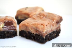 Chocolate Swirl Caramel Fudge Bars are a sweet, gooey, sticky, soft caramel fudge with caramel chocolate (Rolos) mixed throughout the warm caramel to create a swirl on top of an Oreo base. #oreofudge #caramelfudge #caramelchocolatefudge 